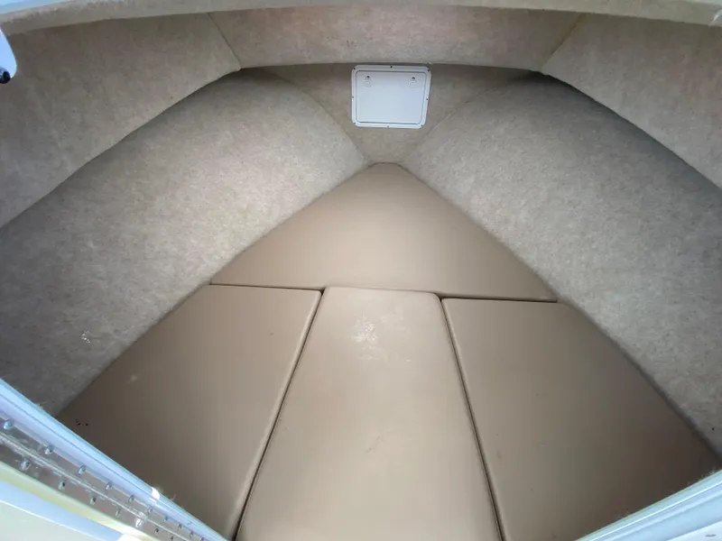 Slide: The Image of 2018 Judge 27 Chesapeake XL cabin interior with beige cushions and carpeted walls. - 26