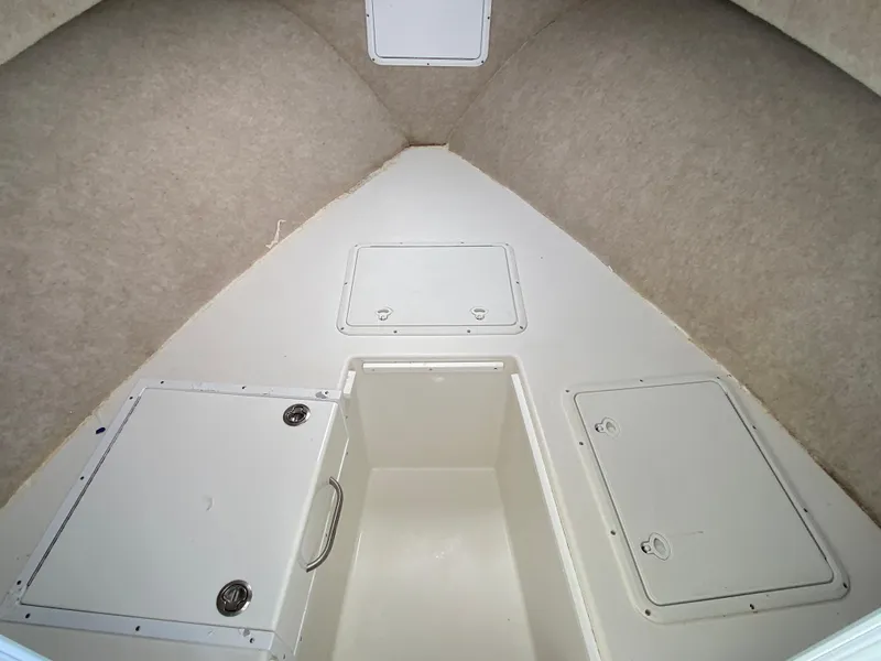 Slide: The Image of 2018 Judge 27 Chesapeake XL cabin interior with storage compartments. - 28