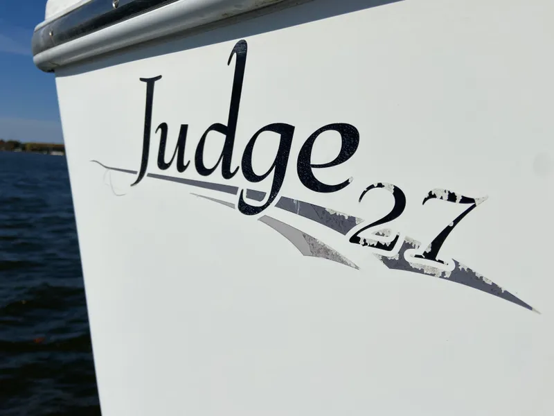 Slide: The Image of 2018 Judge 27 Chesapeake XL boat logo on water background. - 31