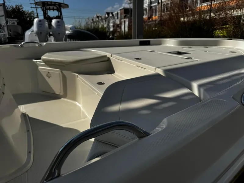 Slide: The Image of 2014 Sailfish 1900 BB Bay Boat interior with seating and storage compartments. - 2
