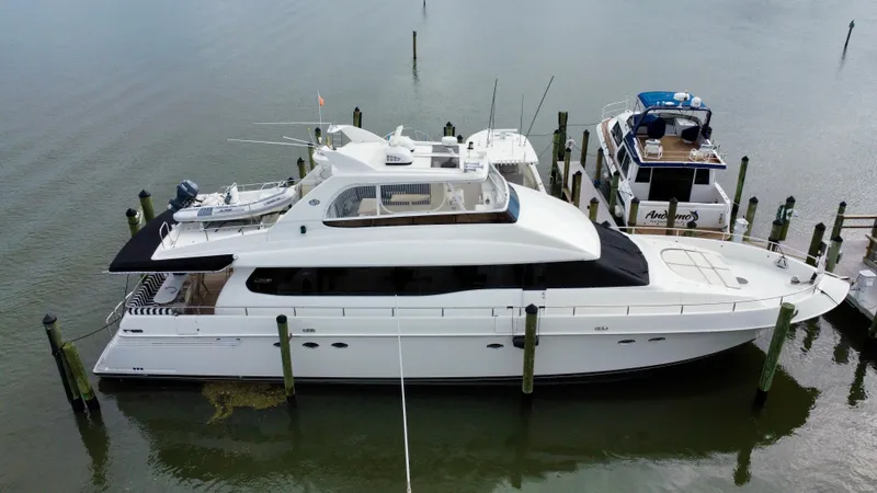 The Image of 1997 Lazzara 76 yacht docked at marina, aerial view. - 0