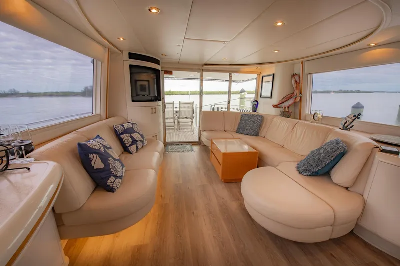 Slide: The Image of Luxurious interior of 1997 Lazzara 76 Motor Yacht with elegant dining area and scenic views. - 11