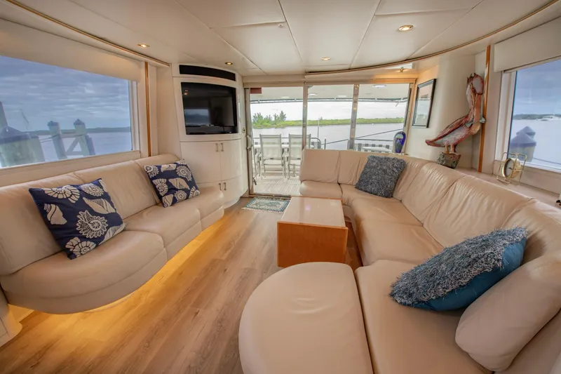 Slide: The Image of Luxurious interior of 1997 Lazzara 76 Motor Yacht with plush seating and scenic views. - 12