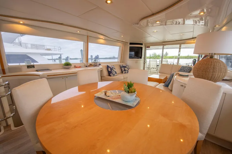 Slide: The Image of Luxurious interior of 1997 Lazzara 76 Motor Yacht with plush seating and scenic views. - 13