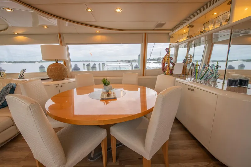 Slide: The Image of Luxurious interior of 1997 Lazzara 76 Motor Yacht with elegant dining area. - 14