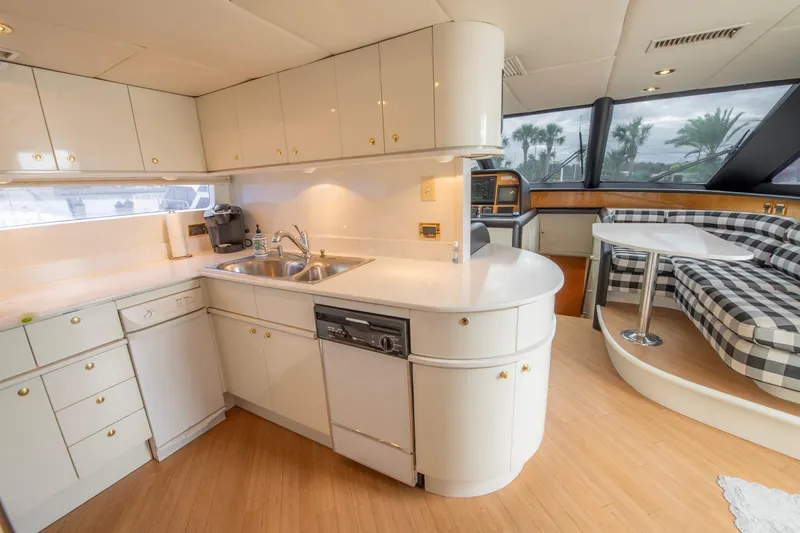 Slide: The Image of Modern kitchen interior of 1997 Lazzara 76 Motor Yacht with white cabinetry and appliances. - 17