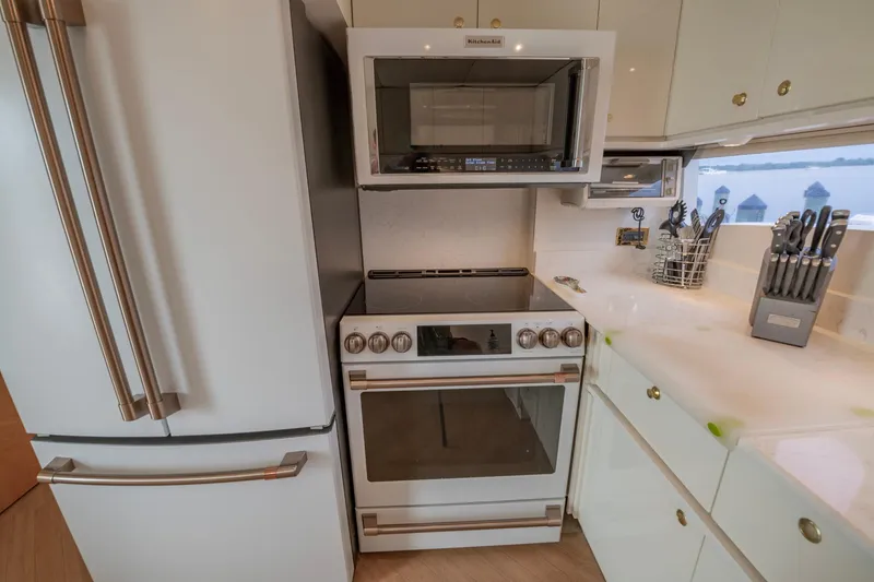 Slide: The Image of Modern kitchen in 1997 Lazzara 76 Motor Yacht with sleek cabinetry and dual sink. - 19