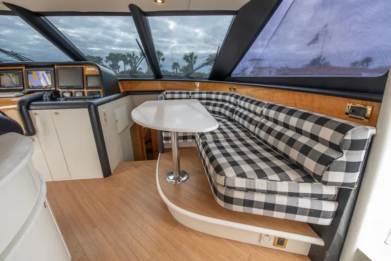 Slide: The Image of Interior of 1997 Lazzara 76 Motor Yacht with elegant staircase and panoramic windows. - 21