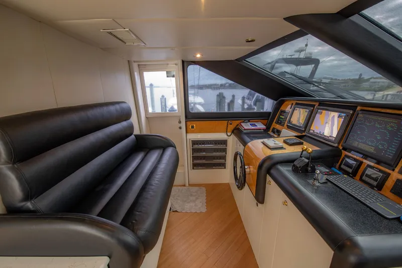 Slide: The Image of Luxurious interior of 1997 Lazzara 76 Motor Yacht with modern kitchen and seating area. - 25