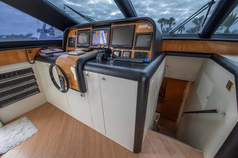 Slide: The Image of Interior helm of 1997 Lazzara 76 Motor Yacht with navigation equipment and leather seating. - 27