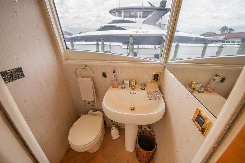 Slide: The Image of Cockpit of 1997 Lazzara 76 Motor Yacht with navigation screens and controls. - 29