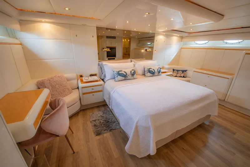 Slide: The Image of Interior of 1997 Lazzara 76 Motor Yacht with modern staircase and cozy bedroom. - 32