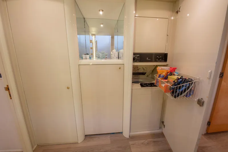 Slide: The Image of Compact kitchen area in a 1997 Lazzara 76 Motor Yacht with modern appliances. - 33