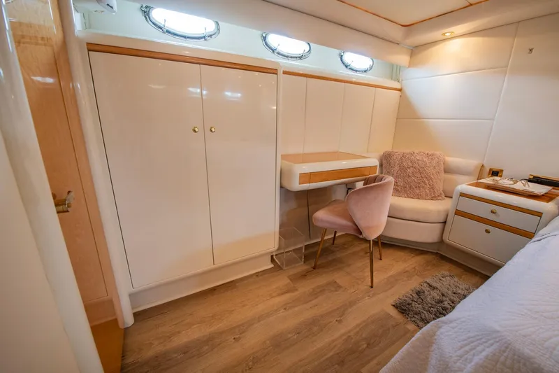 Slide: The Image of Interior of 1997 Lazzara 76 Motor Yacht with elegant furnishings and wood flooring. - 34