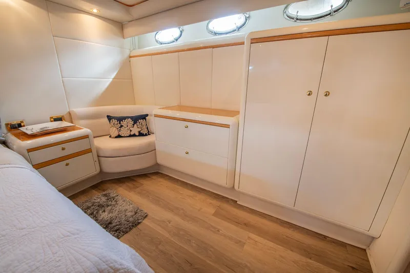 Slide: The Image of Luxurious interior of 1997 Lazzara 76 Motor Yacht with elegant wood flooring and cabinetry. - 36