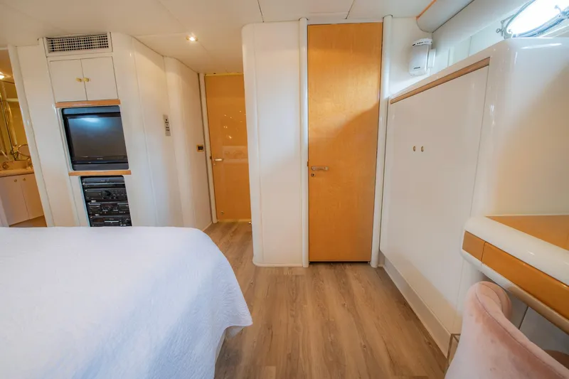 Slide: The Image of Interior of 1997 Lazzara 76 Motor Yacht, featuring modern design and wood accents. - 38