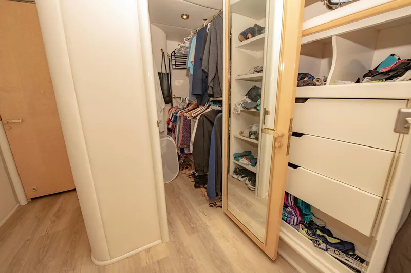 Slide: The Image of Spacious closet in 1997 Lazzara 76 Motor Yacht with organized shelves and hanging clothes. - 39