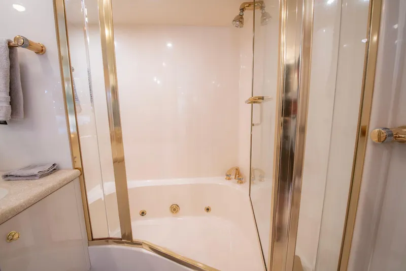 Slide: The Image of Luxurious bathroom with gold accents in 1997 Lazzara 76 Motor Yacht. - 41