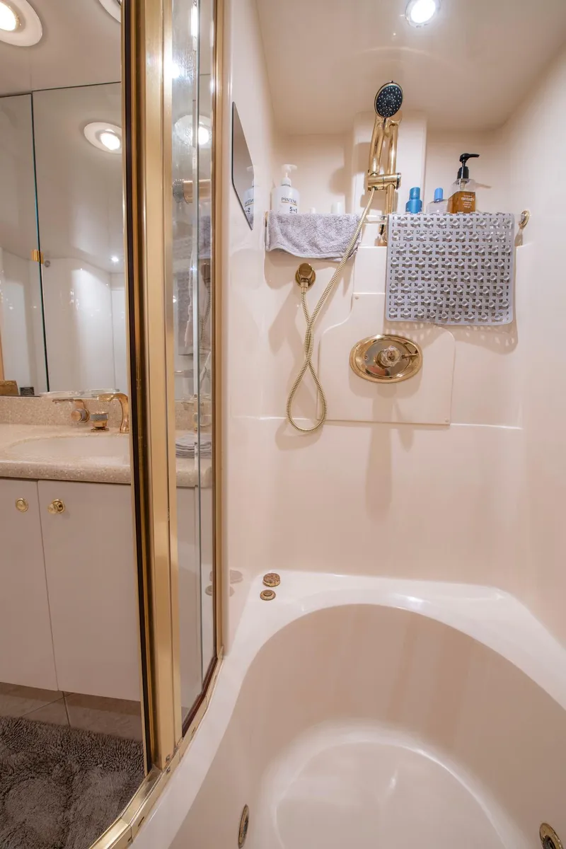 Slide: The Image of Luxurious bathroom in 1997 Lazzara 76 Motor Yacht with shower and tub. - 43