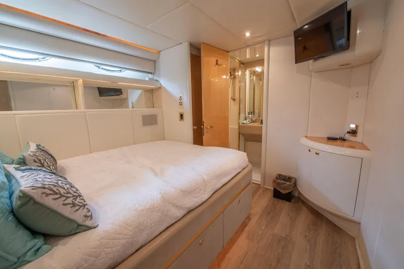 Slide: The Image of Luxurious bedroom interior of 1997 Lazzara 76 Motor Yacht with modern amenities. - 45