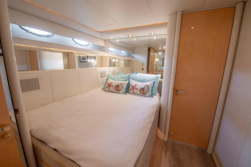 Slide: The Image of Luxurious bedroom interior of 1997 Lazzara 76 Motor Yacht with elegant decor. - 48