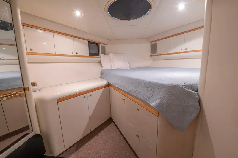 Slide: The Image of Cozy bedroom in 1997 Lazzara 76 Motor Yacht with elegant cabinetry and soft lighting. - 53