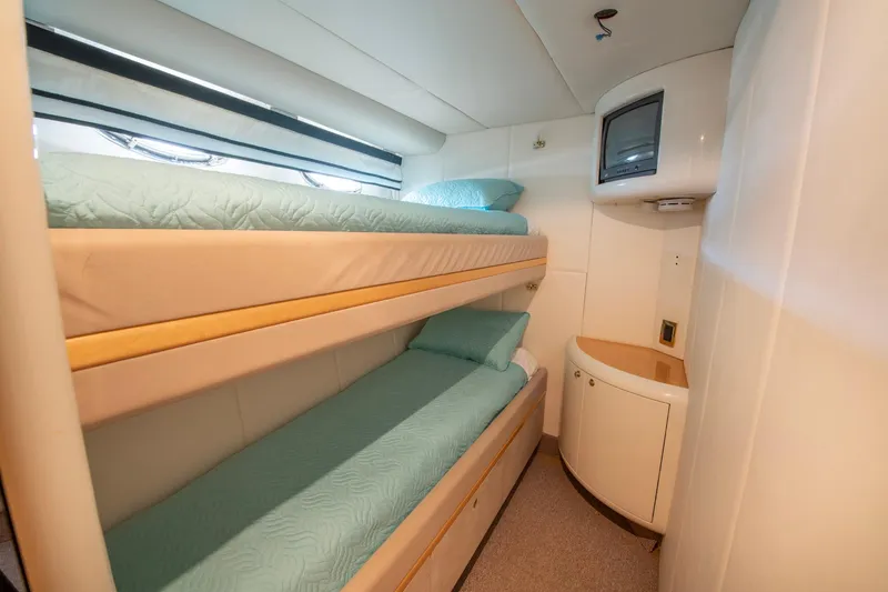 Slide: The Image of Bunk beds in 1997 Lazzara 76 Motor Yacht cabin with TV and storage. - 55