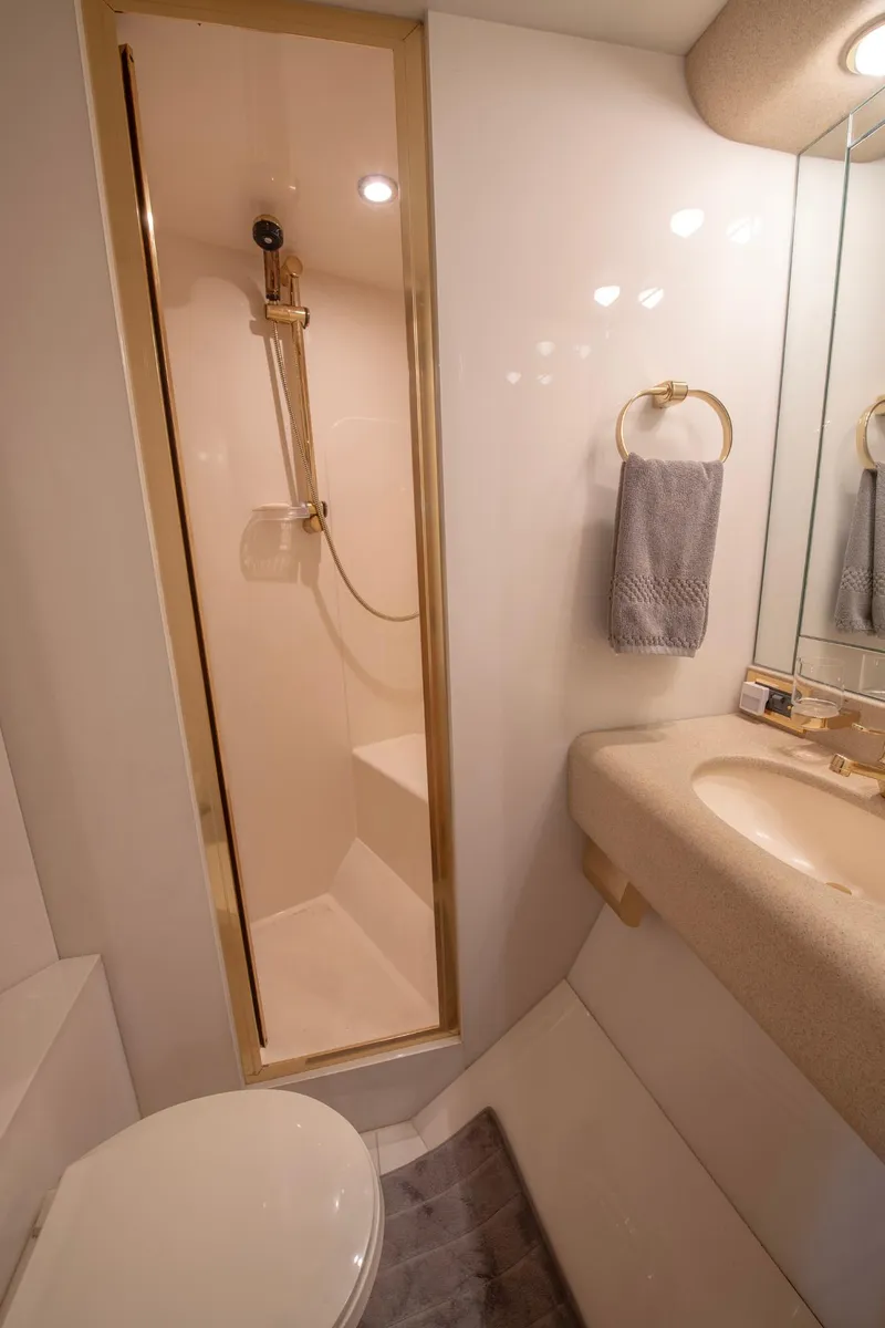 Slide: The Image of Luxurious bathroom in 1997 Lazzara 76 Motor Yacht with shower and elegant fixtures. - 56