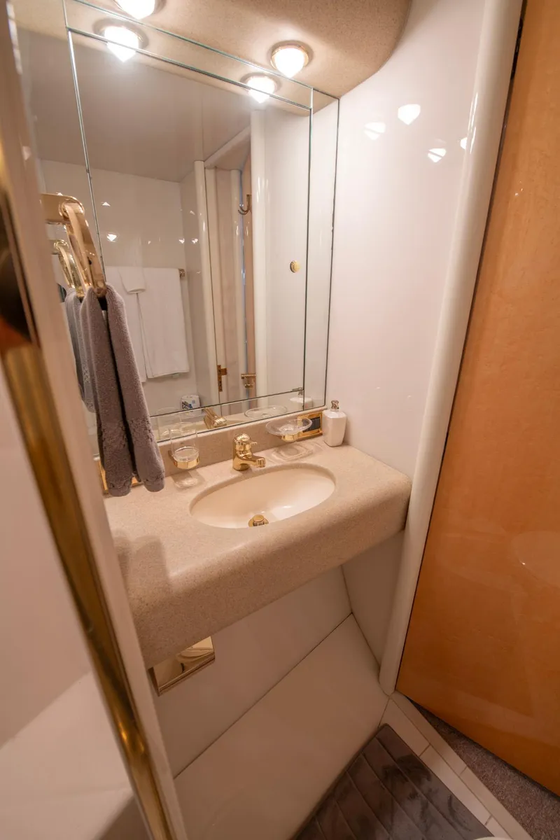 Slide: The Image of Luxurious bathroom in 1997 Lazzara 76 Motor Yacht with elegant fixtures and lighting. - 57