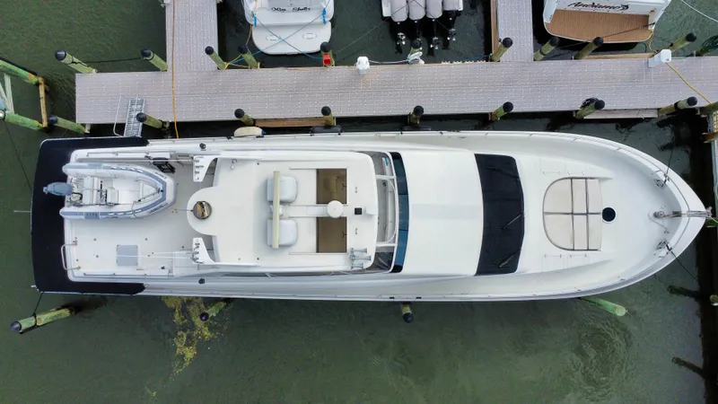 Slide: The Image of 1997 Lazzara 76 yacht docked at marina, aerial view. - 8