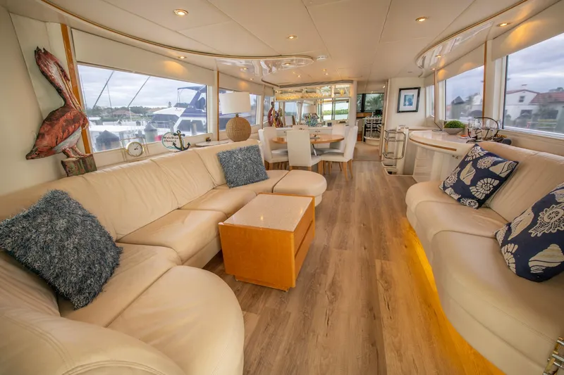 Slide: The Image of 1997 Lazzara 76 yacht docked at marina, featuring sleek design and spacious deck. - 9