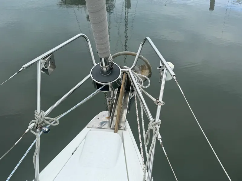 Slide: The Image of Bow of 2004 Beneteau First 47.7 sailboat with anchor and ropes. - 14