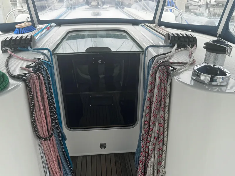 Slide: The Image of Beneteau First 47.7 sailboat cockpit with ropes and winch, 2004 model. - 16