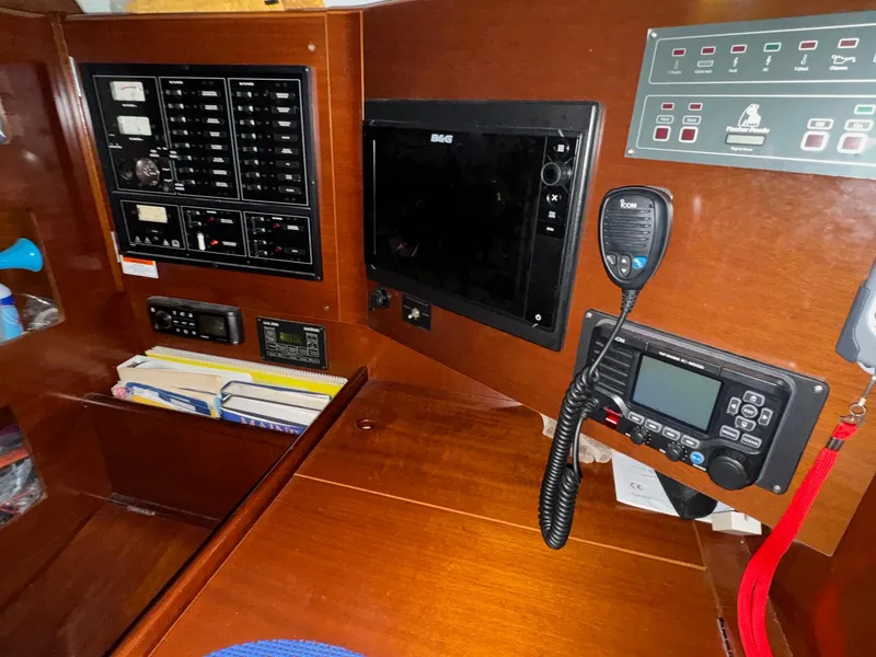 Slide: The Image of Navigation and control panel inside a 2004 Beneteau First 47.7 sailboat. - 26