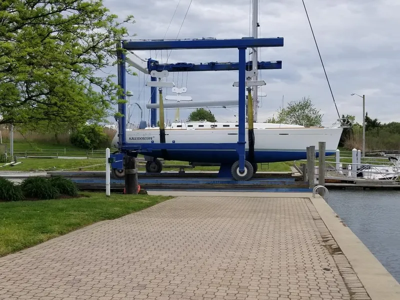 Slide: The Image of Beneteau First 47.7 sailboat on lift at marina, 2004 model. - 32