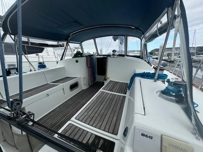 Slide: The Image of Beneteau First 47.7 sailboat cockpit, 2004 model, featuring spacious seating and modern design. - 7