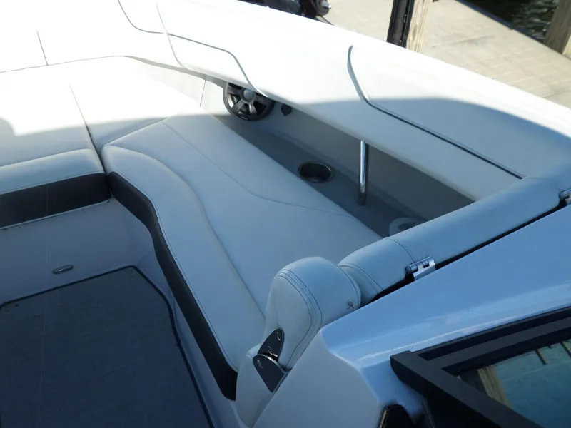 Slide: The Image of 2020 Regal LS6 boat interior with white seating and sleek design. - 16