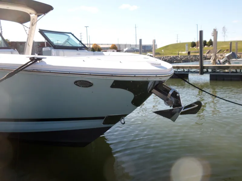 Slide: The Image of 2020 Regal LS6 boat docked, showing anchor and sleek design. - 4