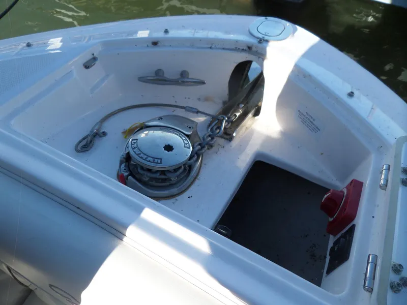 Slide: The Image of 2020 Regal LS6 boat anchor compartment with winch and chain. - 42