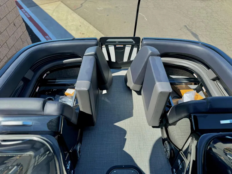 Slide: The Image of 2024 Manitou 23 XT RFXW boat interior with sleek seating and modern design. - 13