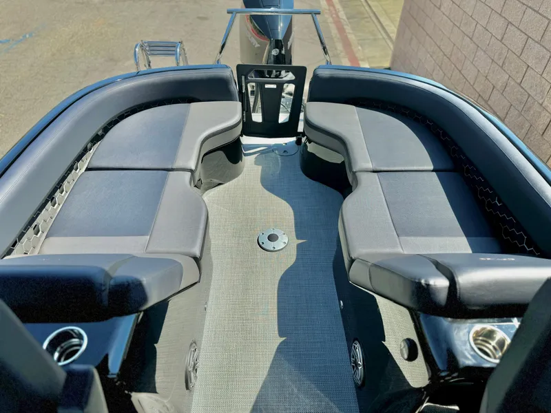 Slide: The Image of 2024 Manitou 23 XT RFXW boat interior with sleek seating and modern design. - 15