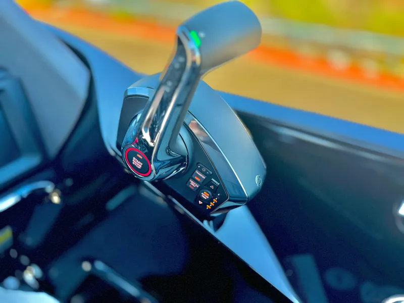 Slide: The Image of 2024 Manitou 23 XT RFXW throttle control, close-up view. - 24