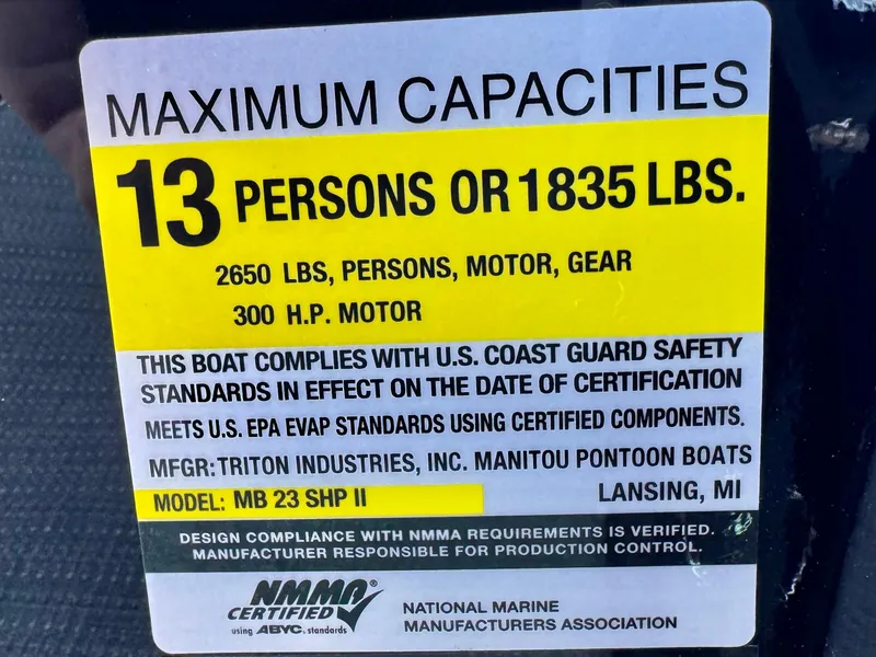 Slide: The Image of Capacity label for 2024 Manitou 23 XT RFXW, 13 persons or 1835 lbs, 300 HP motor. - 32