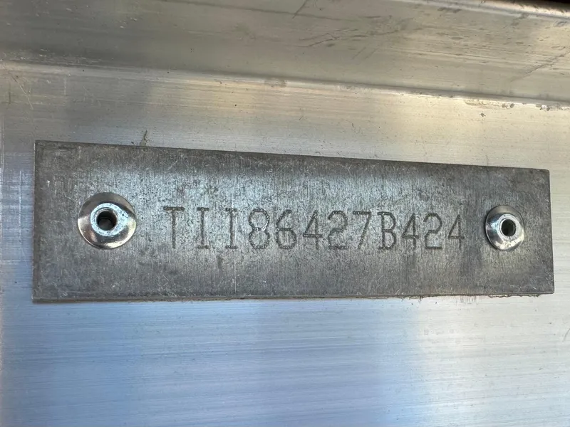 Slide: The Image of Serial number plate on 2024 Manitou 23 XT RFXW boat. - 33