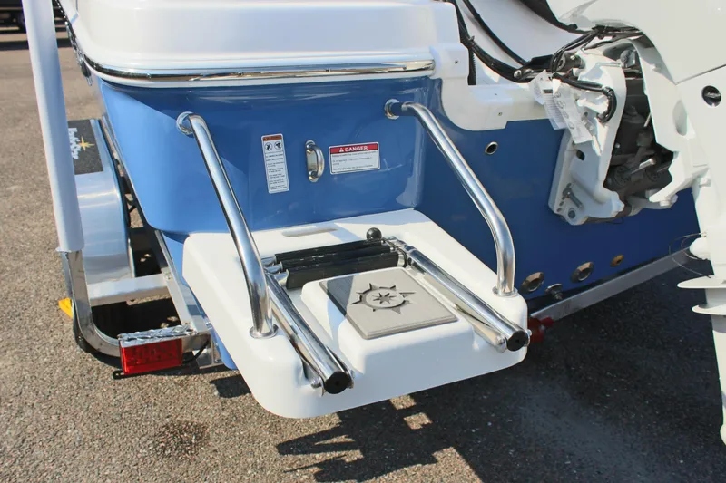 Slide: The Image of 2025 NauticStar 211 Hybrid boat with swim platform and ladder. - 10