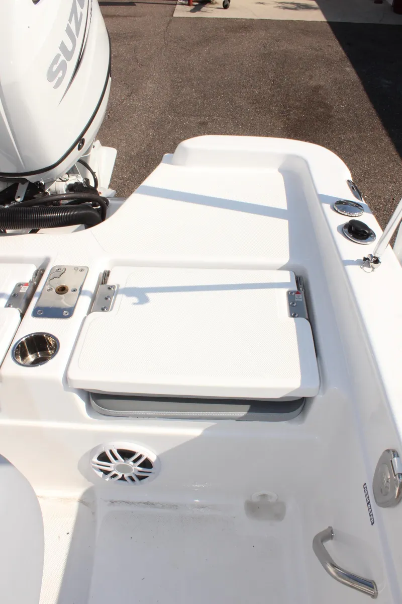 Slide: The Image of 2025 NauticStar 211 Hybrid boat with Suzuki engine, featuring a sleek white deck design. - 11