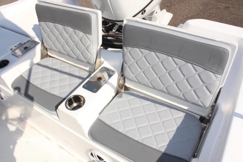 Slide: The Image of 2025 NauticStar 211 Hybrid boat seats with quilted gray upholstery. - 12