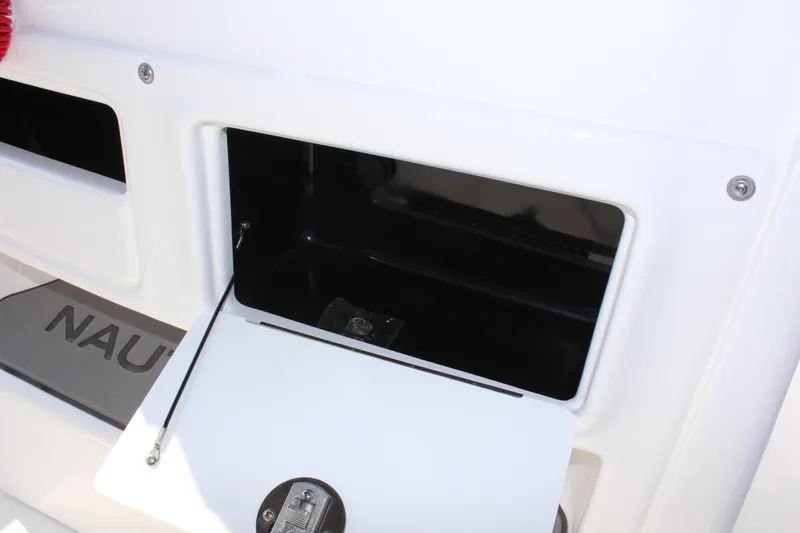 Slide: The Image of 2025 NauticStar 211 Hybrid boat storage compartment, open and empty. - 18