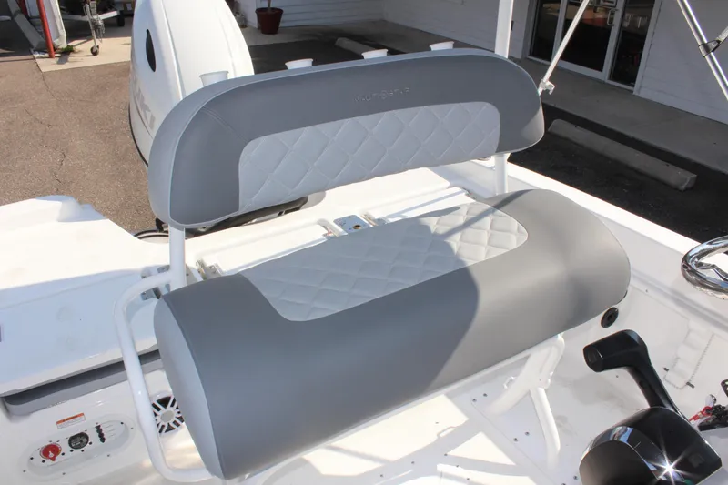 Slide: The Image of 2025 NauticStar 211 Hybrid boat seat with gray and white upholstery. - 19
