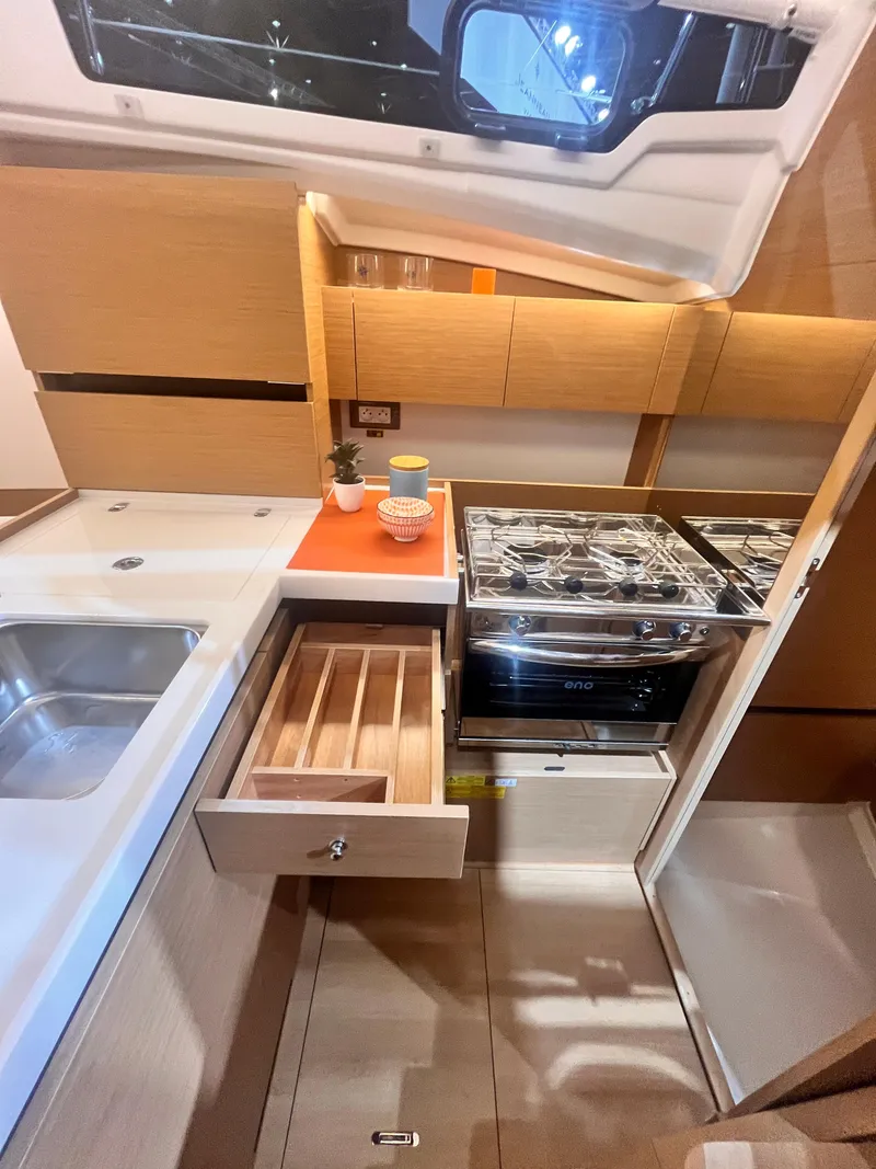 Slide: The Image of Modern kitchen in 2026 Jeanneau Sun Odyssey 350 yacht with stove and sink. - 17